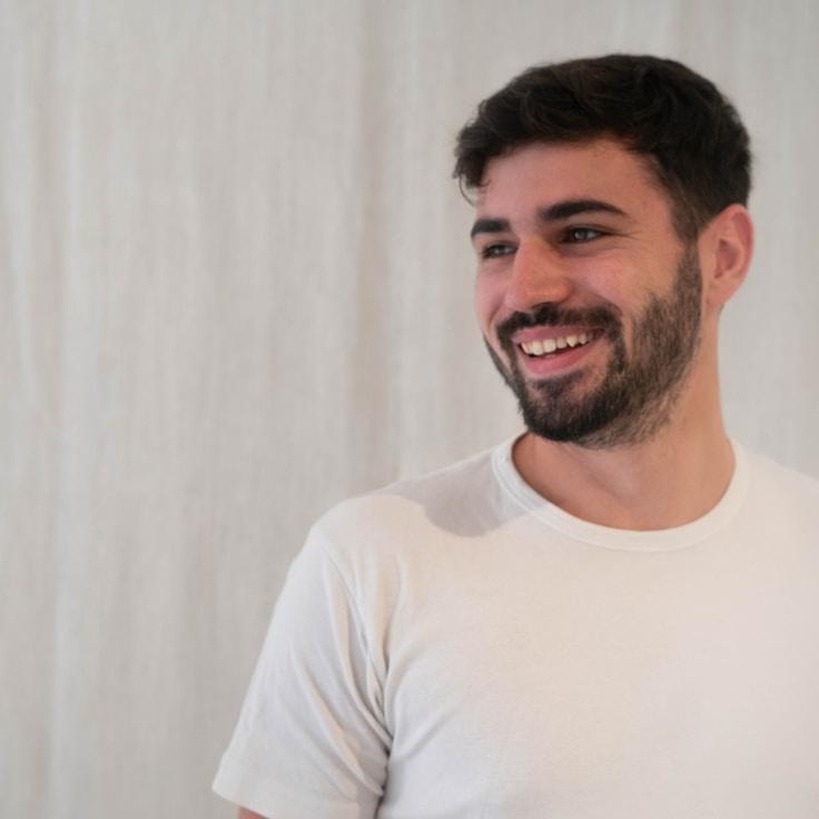 Alex Carter, Lead Design Curator at Drift Grove Calm, reviewing corporate floral arrangements